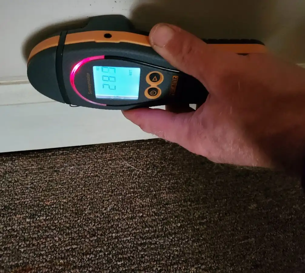Moisture detection at baseboard during Storm Damage Restoration in Warwick